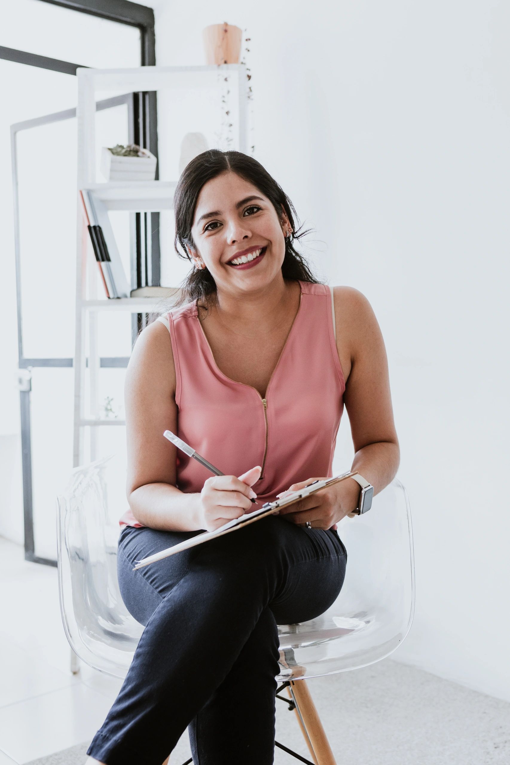 Psychologist holding clipboard in a calm practice setting