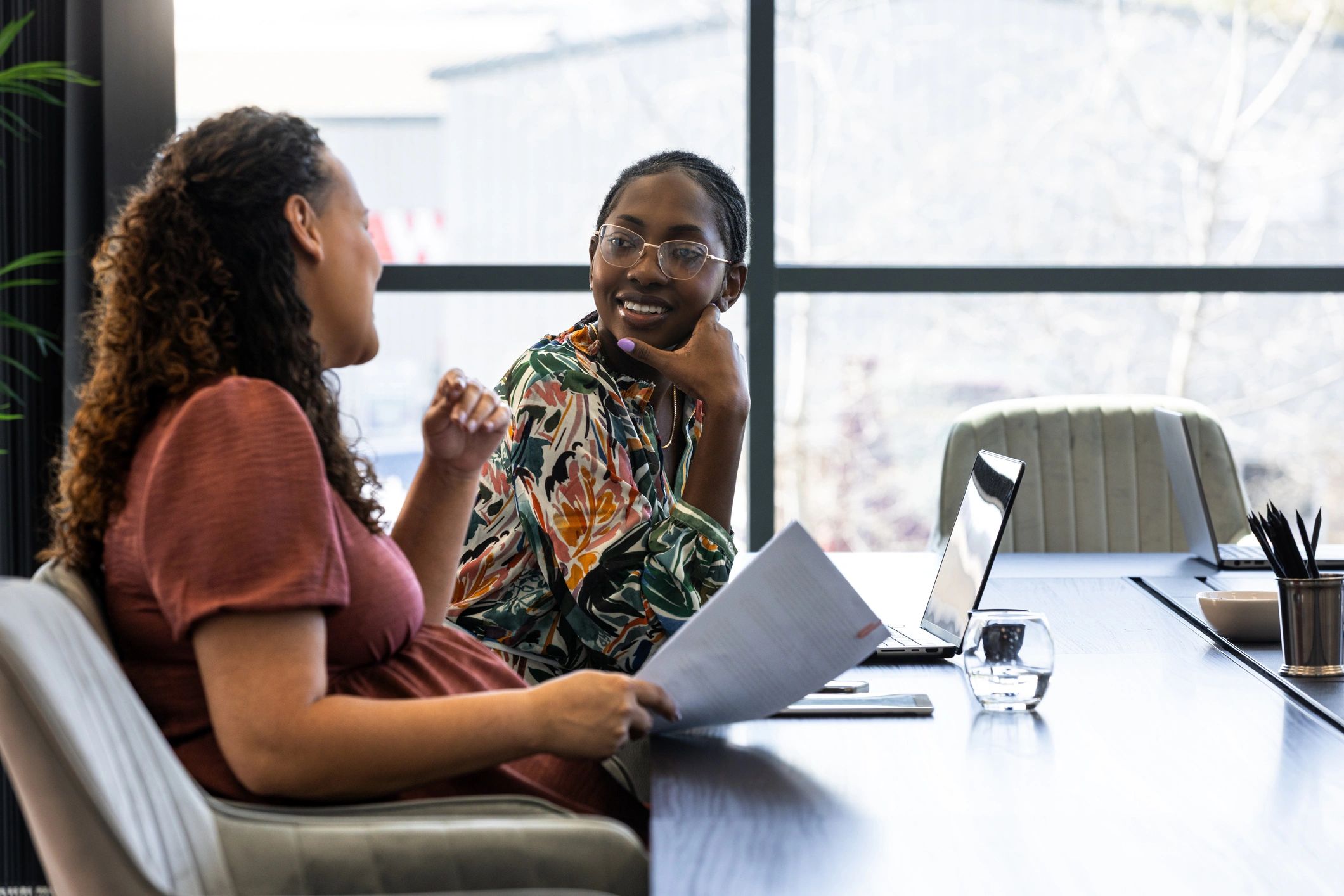 Two professionals in a calm office consultation